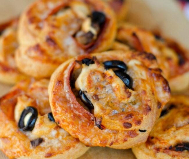 Loaded Pizza Pinwheels made with crescent rolls and stuffed with pizza toppings are a delicious and easy after school snack for your kiddos!