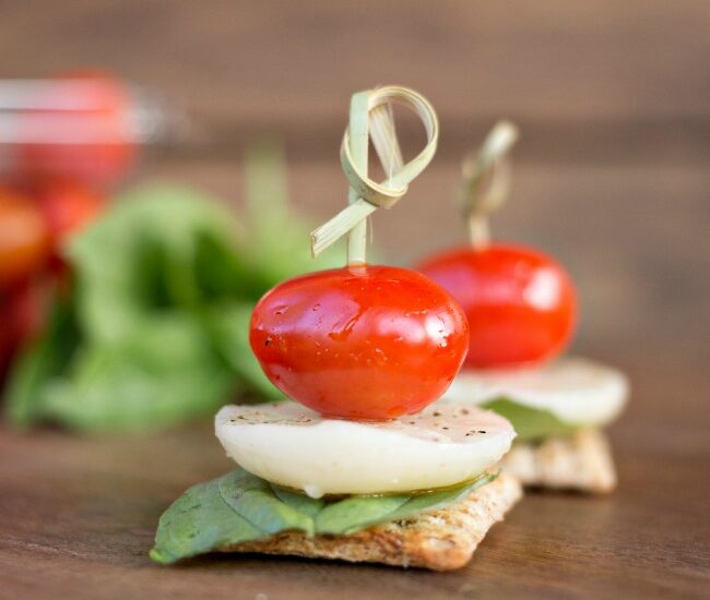 Caprese Triscuit Snacks - mozzarella, basil and tomato stacked up high on your favorite Triscuit cracker! The perfect snack!