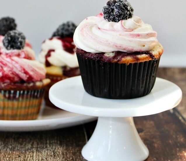 Blackberry Vanilla Swirl Cupcakes - vanilla cupcakes swirled with blackberry and porter compote, topped with decadent blackberry swirl frosting!