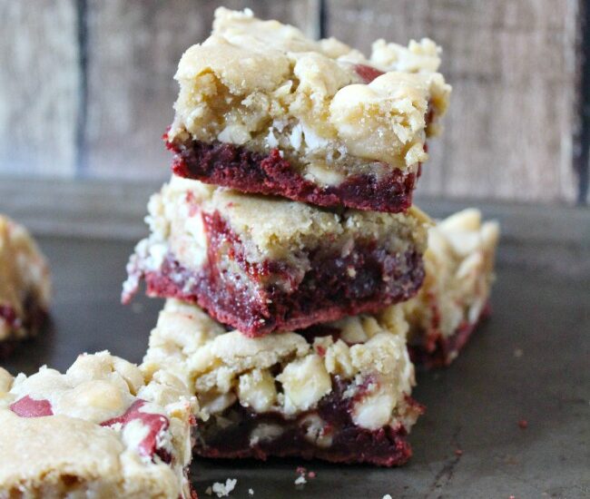 Red Velvet Cookie Bars - red velvet brownies topped with white chocolate macadamia nut cookie dough make for a decadent treat!