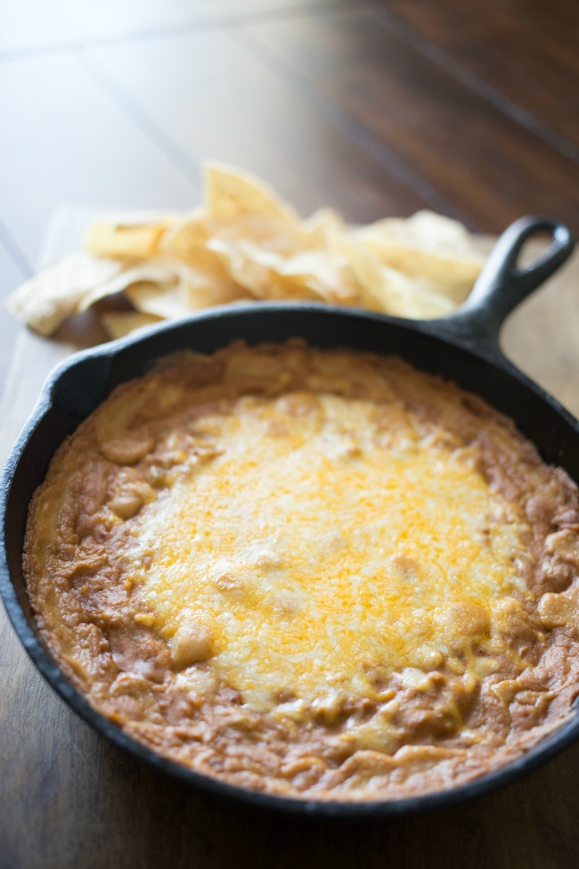 Whip up this easy and delicious Green Chile Bean Dip in one skillet and serve!