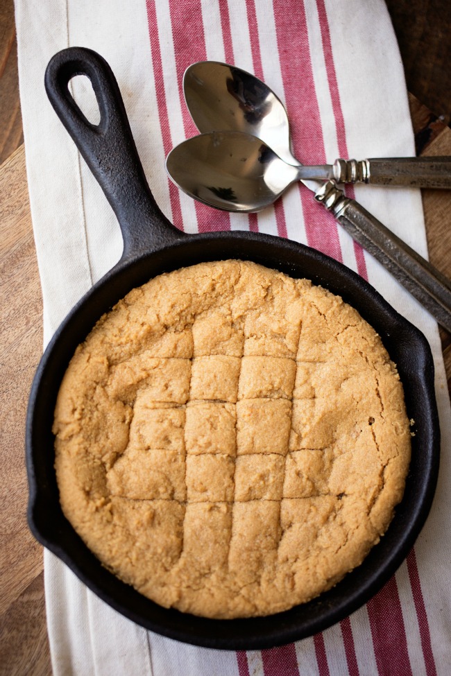 This Peanut Butter Skillet Cookie is easy to whip up and absolutely delicious served warm and topped with ice cream!