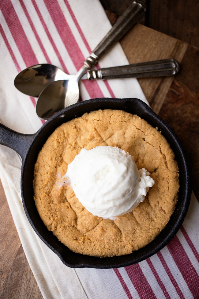 This Peanut Butter Skillet Cookie is easy to whip up and absolutely delicious served warm and topped with ice cream!