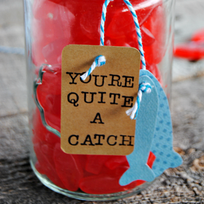 Let your guy know he is "quite a catch" with this easy, adorable Swedish Fish Valentine's Gift complete with a hand stamped tag and stringer of paper fish!