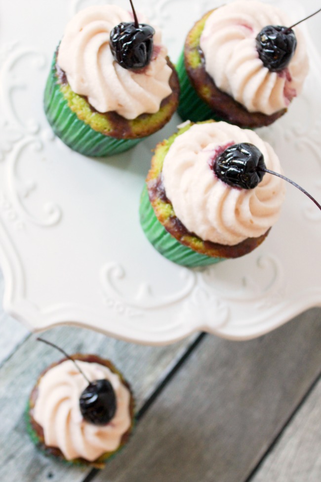 Cherry Limeade Cupcakes - sweet, subtle lime cake meets cherry curd in this bakers' confectionery take on a cherry limeade.