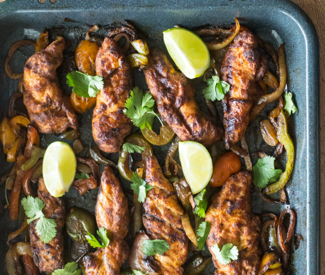 These Fire Grilled Sheet Pan Fajitas are packed full of flavor and are ready in just 20 minutes!
