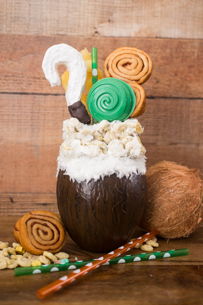 If you like Pina Coladas...you'll love this Disney inspired Moana Pina Colada Freak Shake! A delicious tropical shake topped with Moana inspired treats.