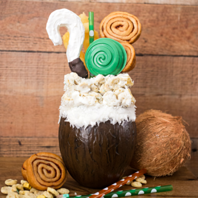 If you like Pina Coladas...you'll love this Disney inspired Moana Pina Colada Freak Shake! A delicious tropical shake topped with Moana inspired treats.