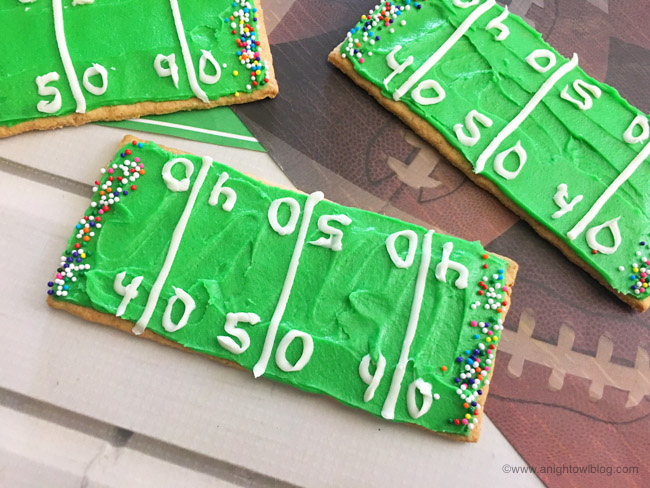 Perfect for your football-loving kiddos, whip up these easy Football Stadium Graham Cracker Treats in just minutes!