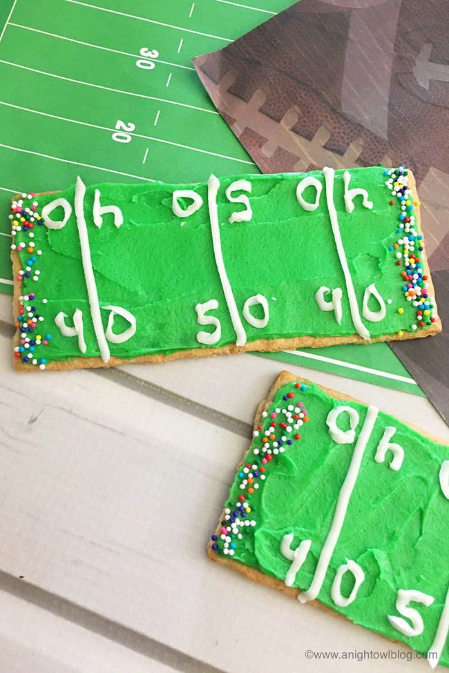Perfect for your football-loving kiddos, whip up these easy Football Stadium Graham Cracker Treats in just minutes!