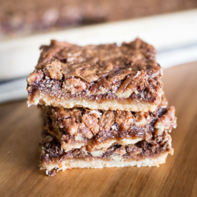 Perfect for the holidays, these easy and delicious Maple Chocolate Pecan Pie Bars will feed a crowd!