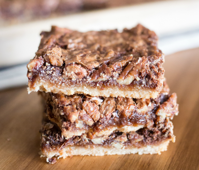 Perfect for the holidays, these easy and delicious Maple Chocolate Pecan Pie Bars will feed a crowd!