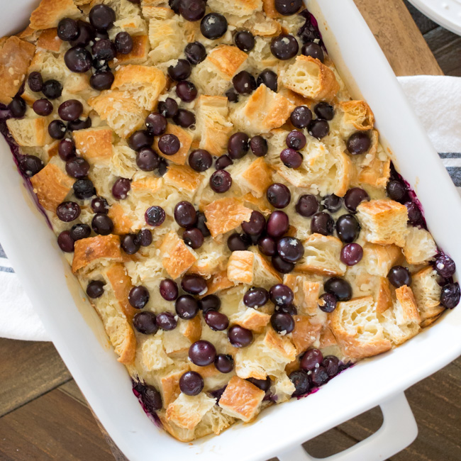 A breakfast casserole made with croissants, cream cheese and fresh blueberries, this Easy Blueberry Danish Breakfast Casserole will be the hit with your family and guests at your next brunch!