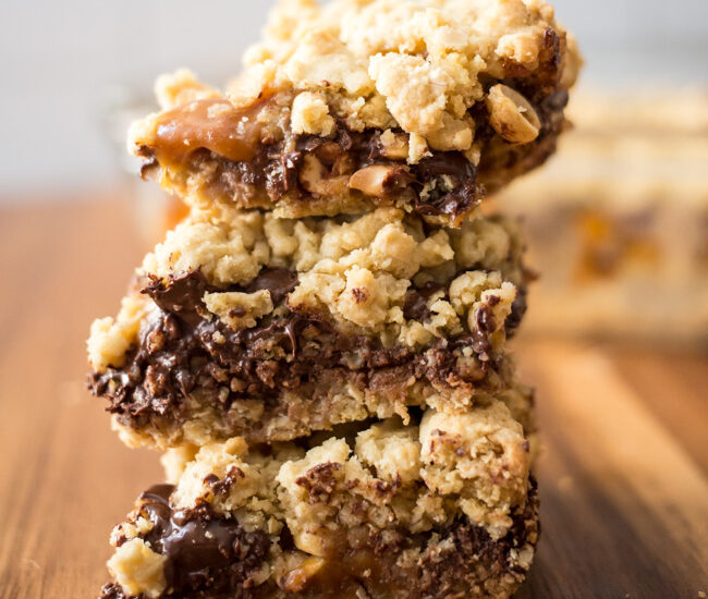 Stuffed with Werther's Soft Caramels, peanuts and chocolate chips, you're going to drool over these Stuffed Caramel Chocolate Chip Cookie Bars! #chocol