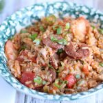 Made with chicken, sausage, shrimp and vegetables, this Instant Pot Jambalaya is a quick and hearty pressure cooker meal your family will love!