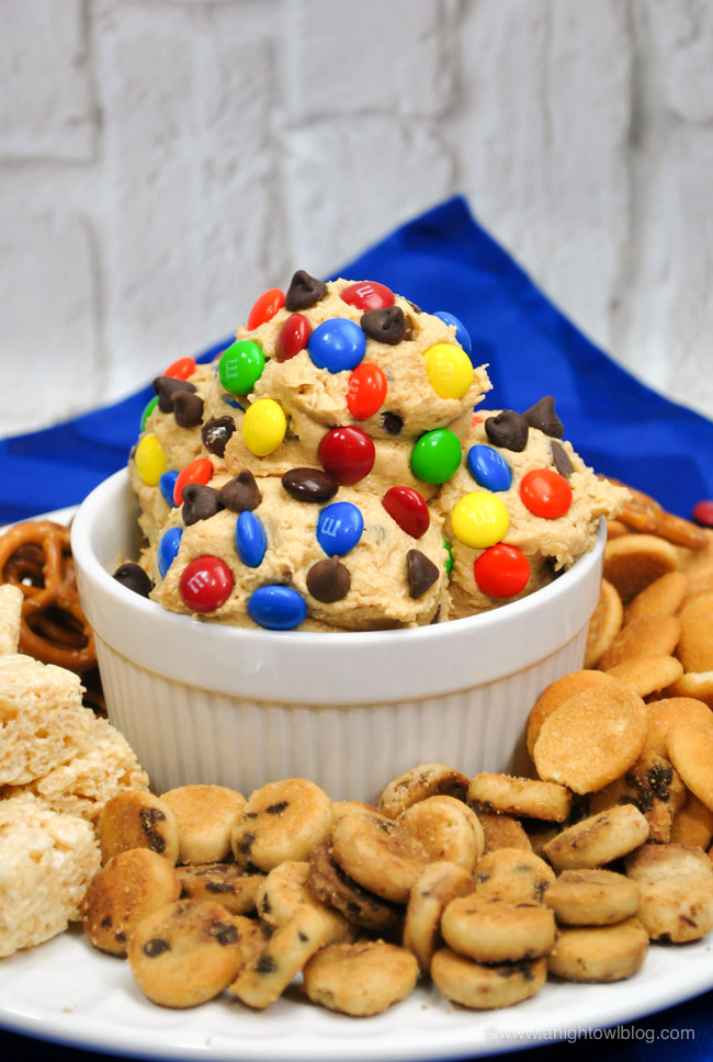 Loaded with chocolate chips, M&Ms and oatmeal, this Monster M&M Chocolate Chip Cookie Dough Dip is going to be a hit with your kids or at your next get together!