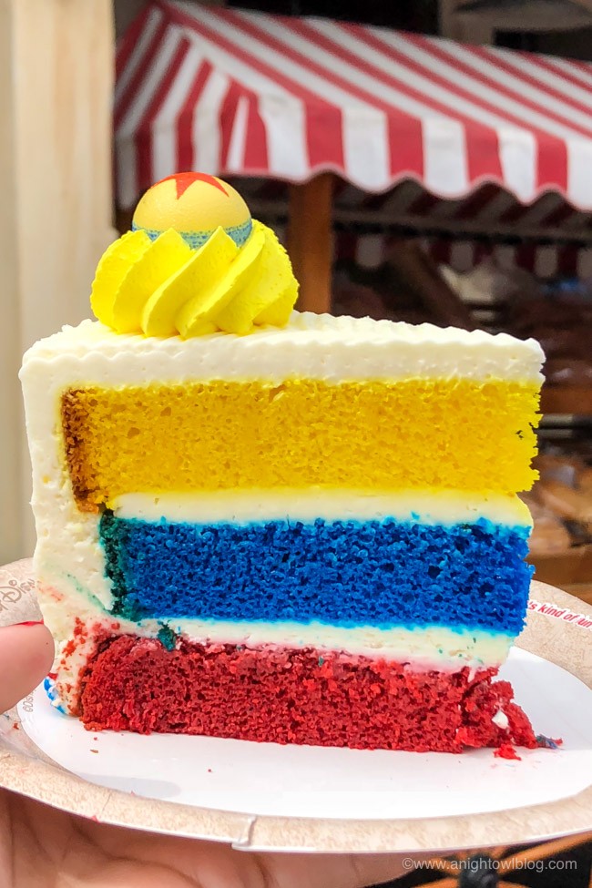 Pixar Lemon-Raspberry Cake from Pacific Wharf Café, Disney California Adventure Park, Pacific Wharf | From Cheeseburger Pizza from Alien Pizza Planet to the Toy Story Root Beer Float in a Souvenir Boot, check out our picks for The BEST Disneyland Pixar Fest Food finds! #Disneyland #PixarFest