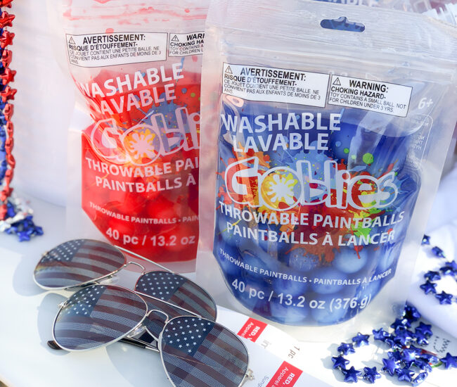 Perfect for a fun, 4th of July outdoor party idea, throw a Patriotic Goblies Paintball Party with Goblies Throwable Paintballs & Power Paint Shot, available Nationwide at Michaels Stores