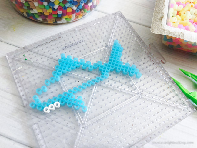 This Shark Perler Bead Pattern to make Shark Keychains is the perfect kid or shark lover activity for #SharkWeek, a Shark Party and more!