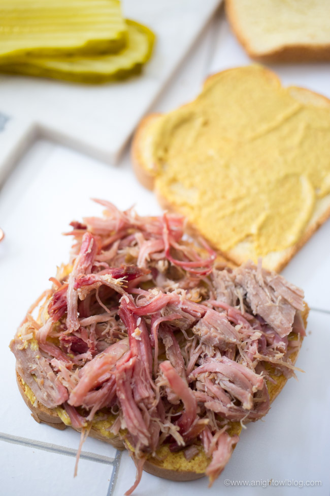 This Easy Cuban Club Sandwich is made with ham, pulled pork, Swiss cheese, pickles, mustard and Sara Lee Butter Bread for a sandwich that is hearty and full of flavor!