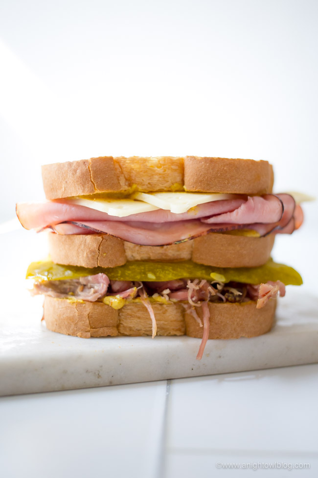 This Easy Cuban Club Sandwich is made with ham, pulled pork, Swiss cheese, pickles, mustard and Sara Lee Butter Bread for a sandwich that is hearty and full of flavor!