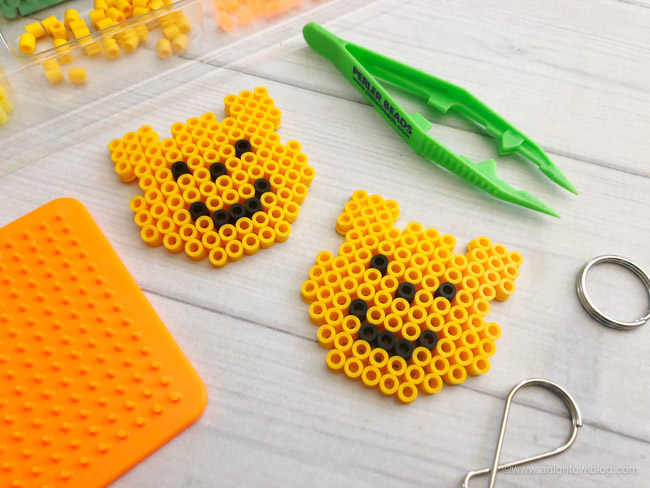 Just in time for Disney's Christopher Robin, these Winnie the Pooh Perler Bead Keychains are a fun and easy craft for kids or Winnie the Pooh fans!