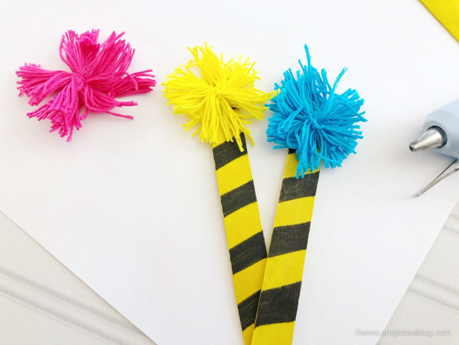 A perfect craft for Read Across America and Dr. Seuss celebrations, make these fun and easy Dr. Seuss Truffula Tree Bookmarks.