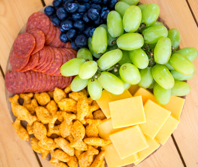 Perfect for after school snacks and more, put together an adorable and delicious Kids Rainbow Charcuterie Board with NEW Goldfish Epic Crunch!