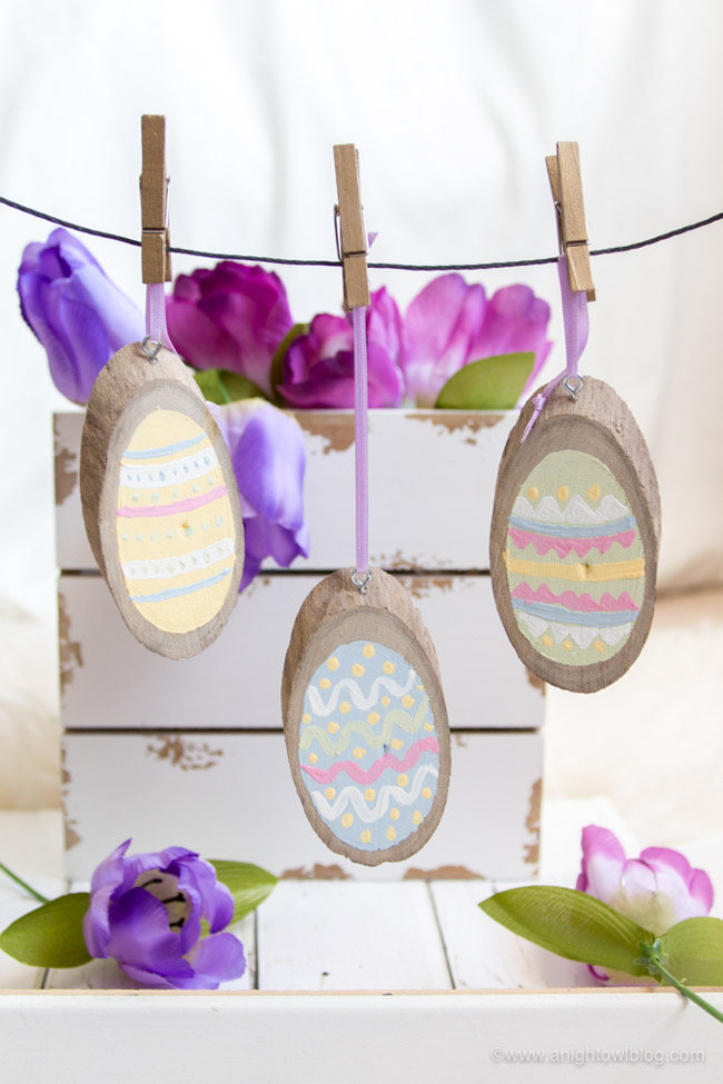 Perfect for Easter Decor, Easter Basket tags and more, create these adorable and easy Painted Wood Slice Easter Eggs in just minutes!