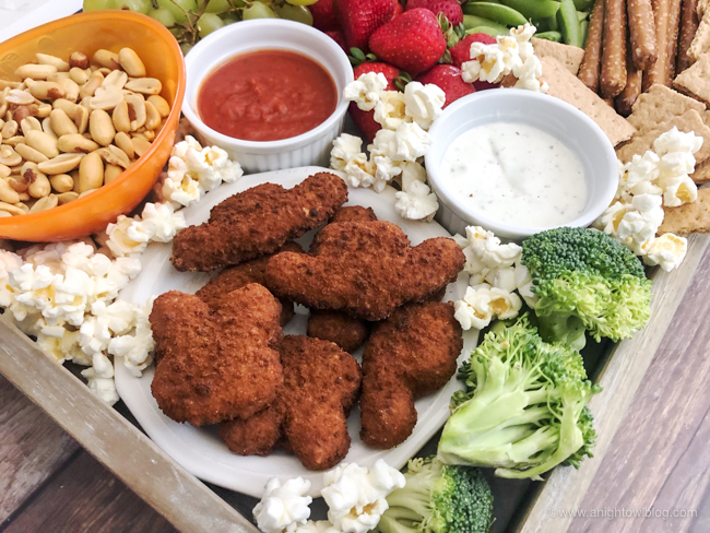 Perfect for fans of the films, whip up this adorable Toy Story Kid Friendly Snack Board for movie night, after school snacks and more with Farm Rich Snacks!