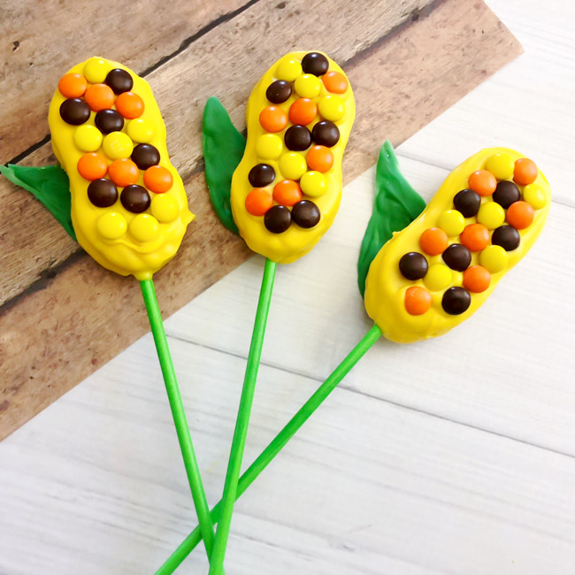 Perfect for Thanksgiving or fall parties, whip up these adorable Harvest Corn Cookie Pops in just a few easy steps!