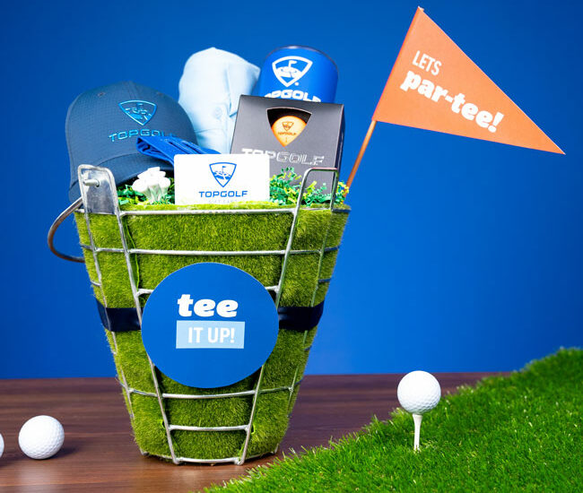 Perfect for the golf lover in your life, whip up a “Tee It Up” Golf Gift Basket with Evite And Topgolf!