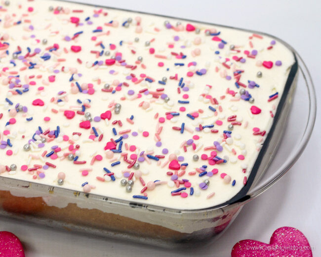 Perfect for Valentine's Day, this White Texas Sheet Cake is fun, festive and delicious! 