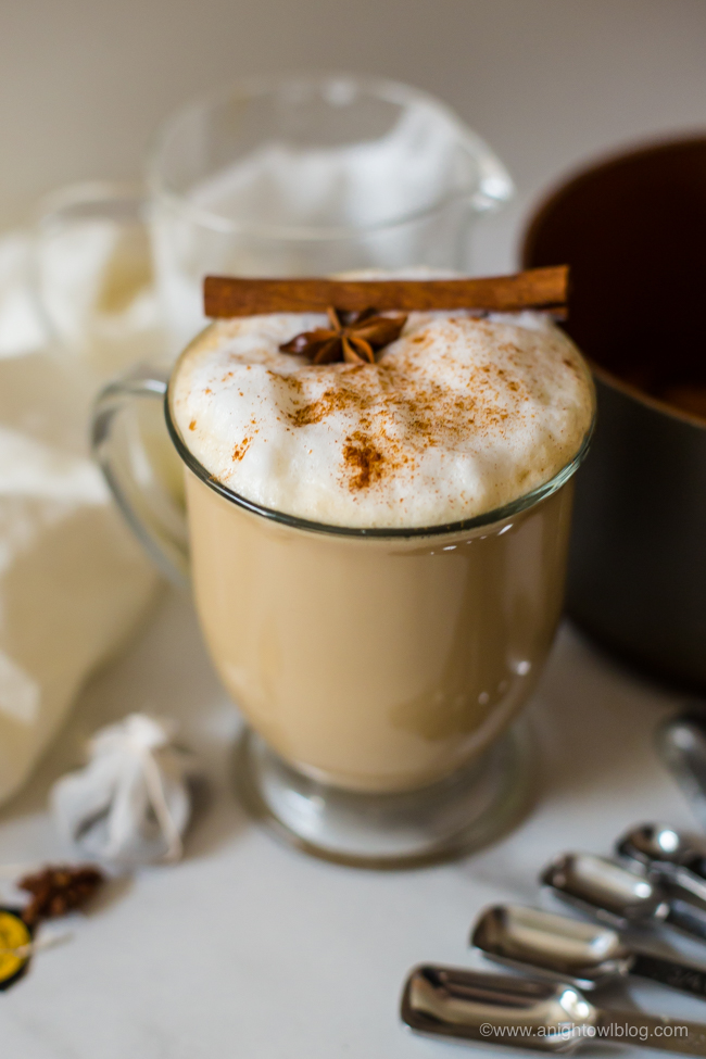 mug of chai tea latte garnished with star anise and cinnamon